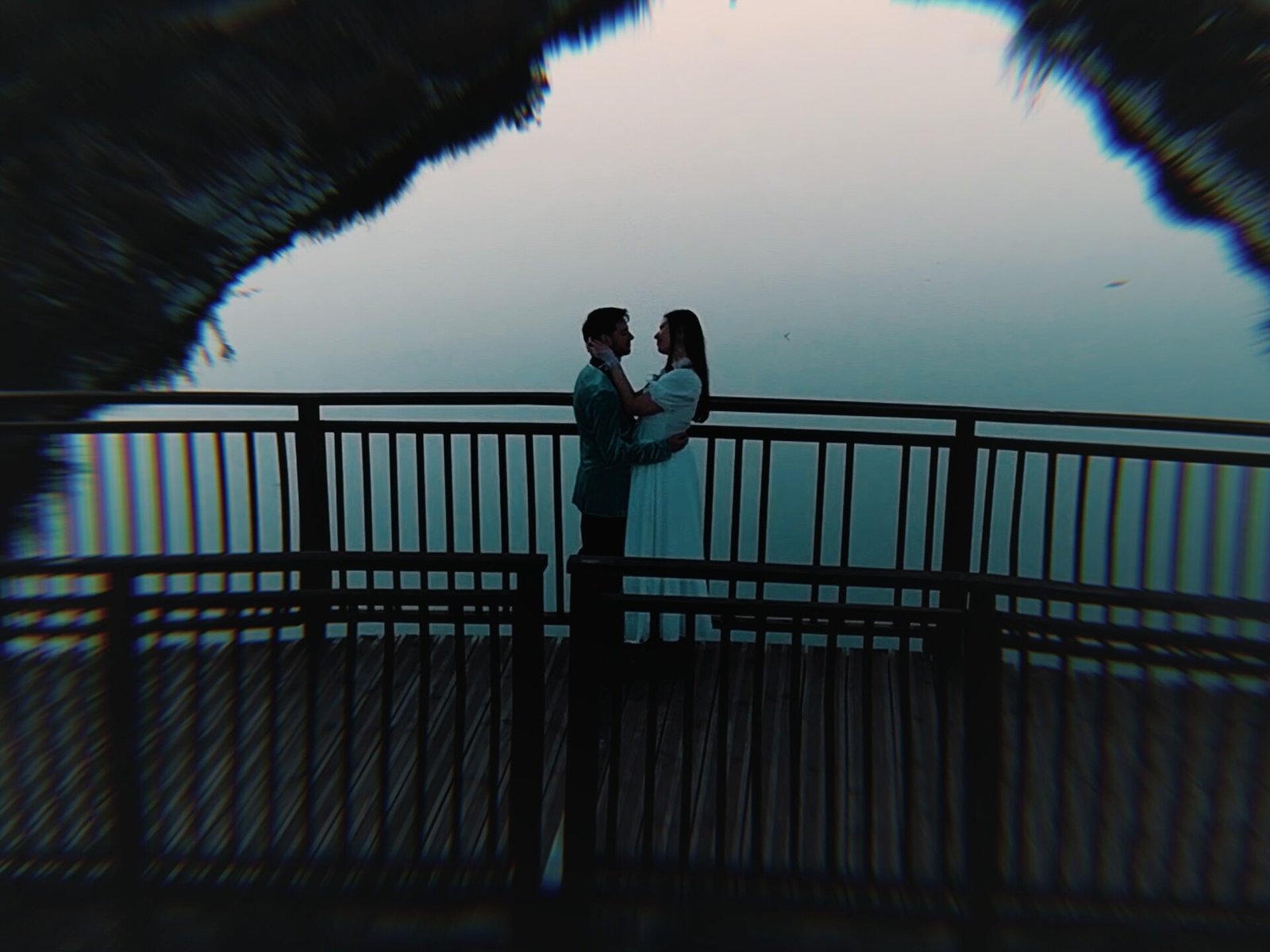 Carmina and Roberto on a railing at sunset, Sendero Belcaire, Moncofa